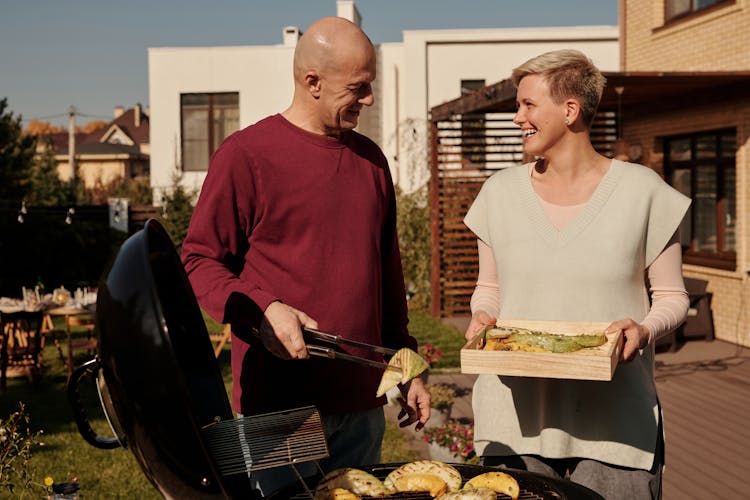 A Couple Cooking Food Together