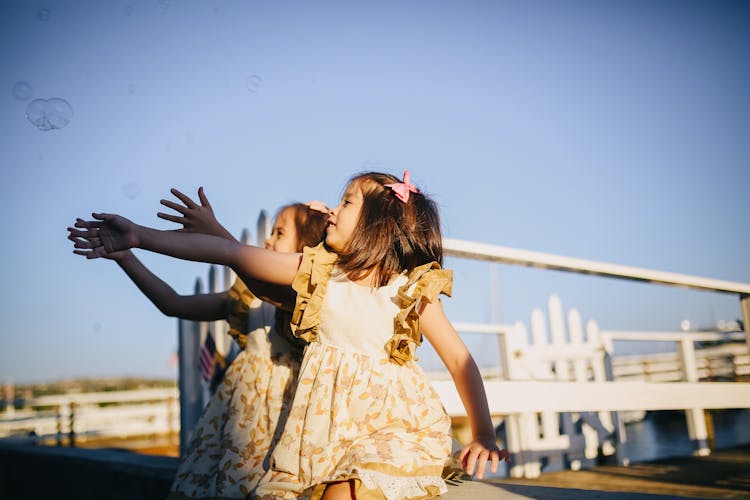 Girls Playing With Bubbles