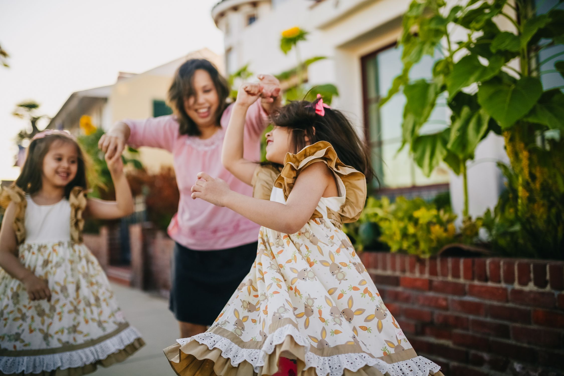 Mother Dancing with Her Daughters on the Street · Free Stock Photo