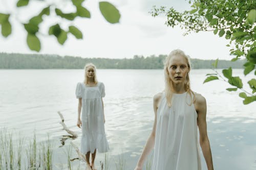 Blonde Women in White Dresses on Lakeshore