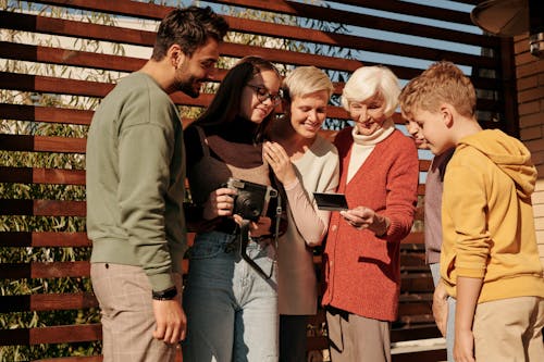 Free People Looking at a Photo Stock Photo