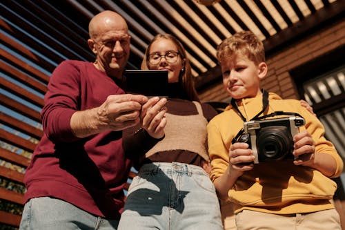 Free People Looking at a Photo Stock Photo