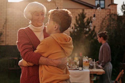 Free Elderly Woman Hugging Her Grandson Stock Photo