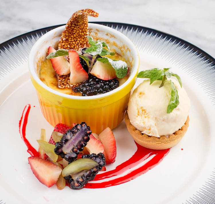 Close-Up Photo Of A Crème Brûlée With Fruits