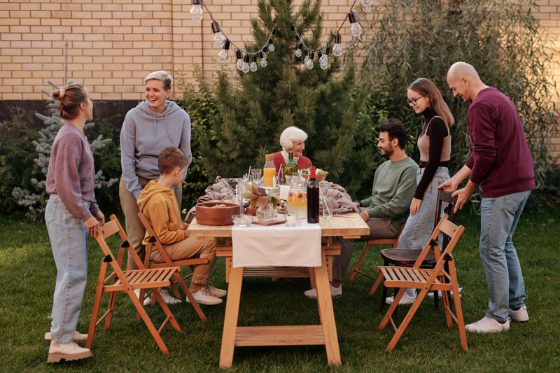 Older adults laughing together at a festive birthday celebration