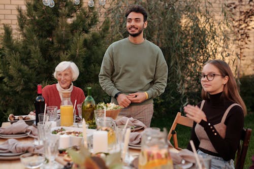Free Happy family sitting at table in terrace Stock Photo