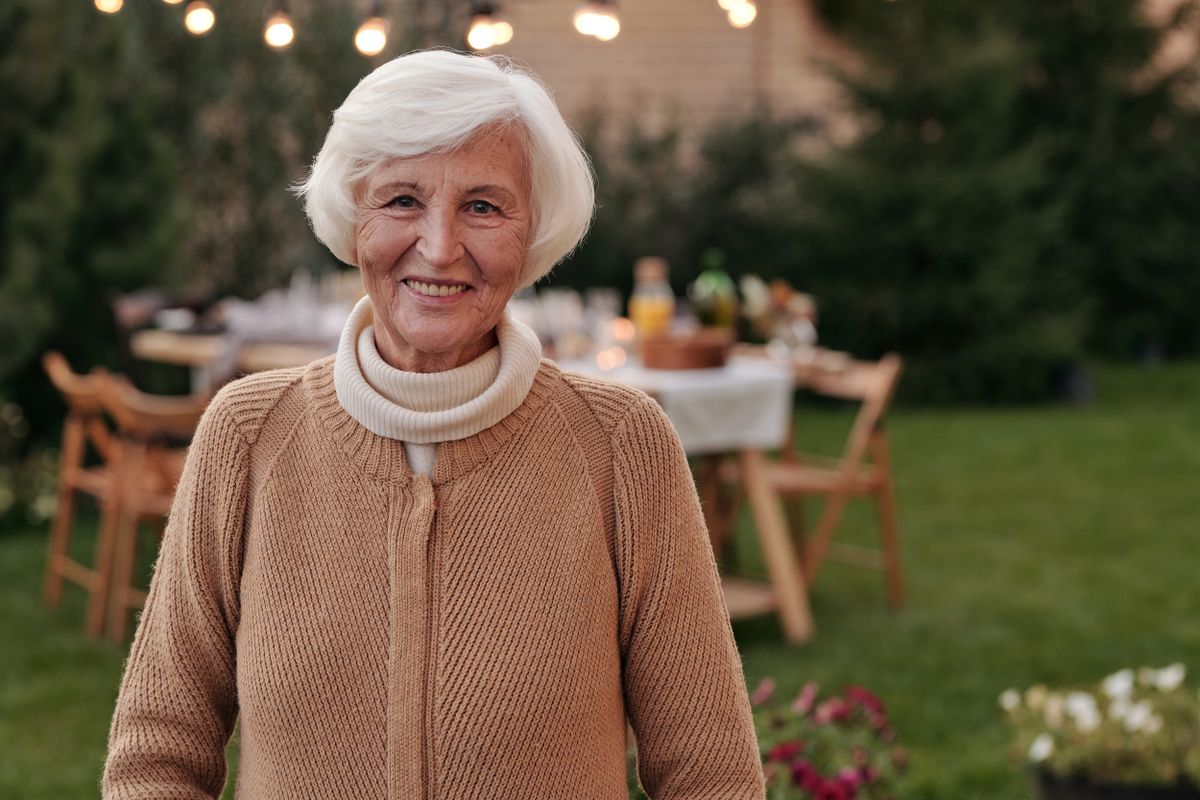 Cheerful mature woman enjoying time outdoors
