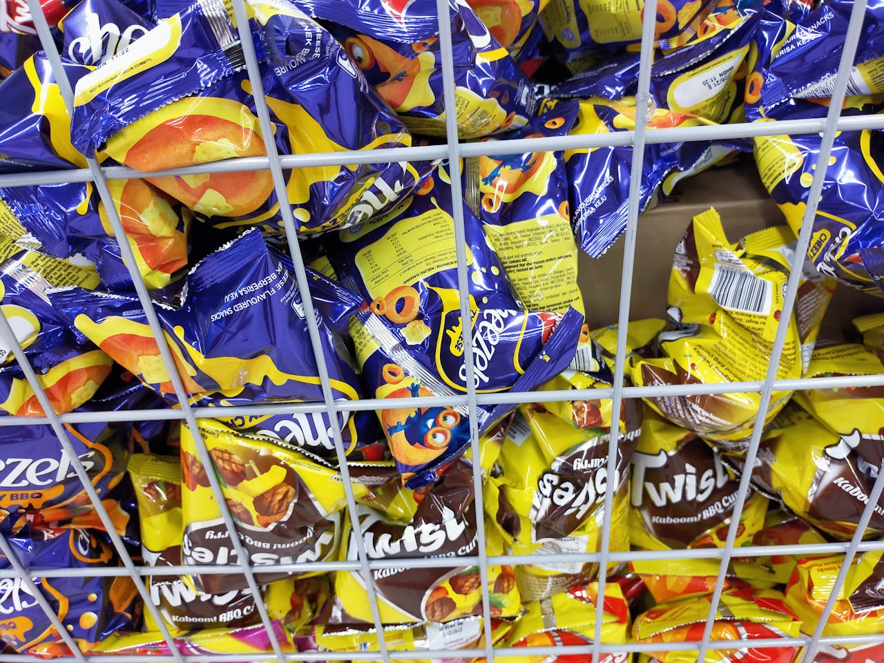 Parents teaching a child about safety around animals in a backyard setting