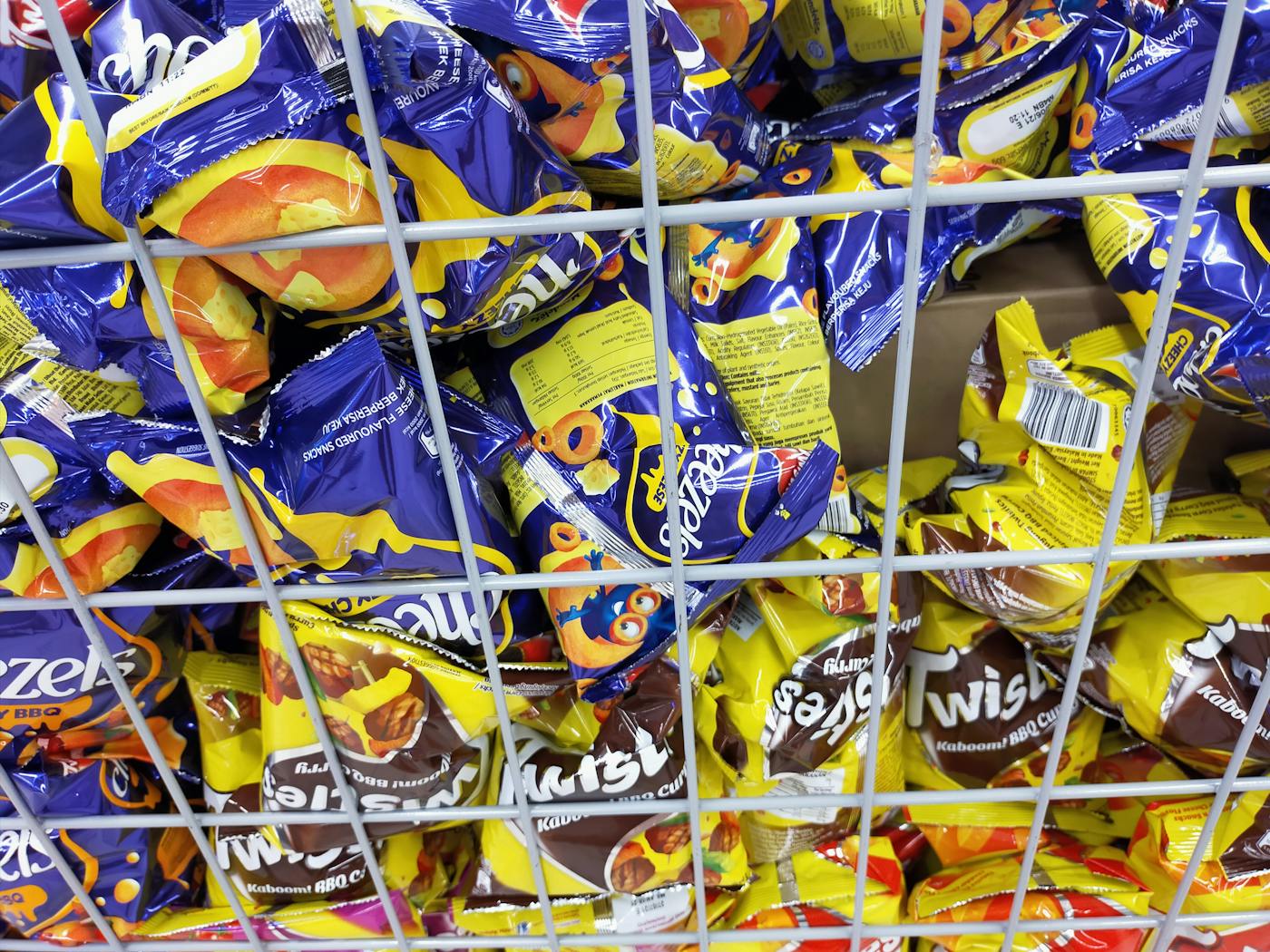 Friends gathered around a TV with snacks watching an event together