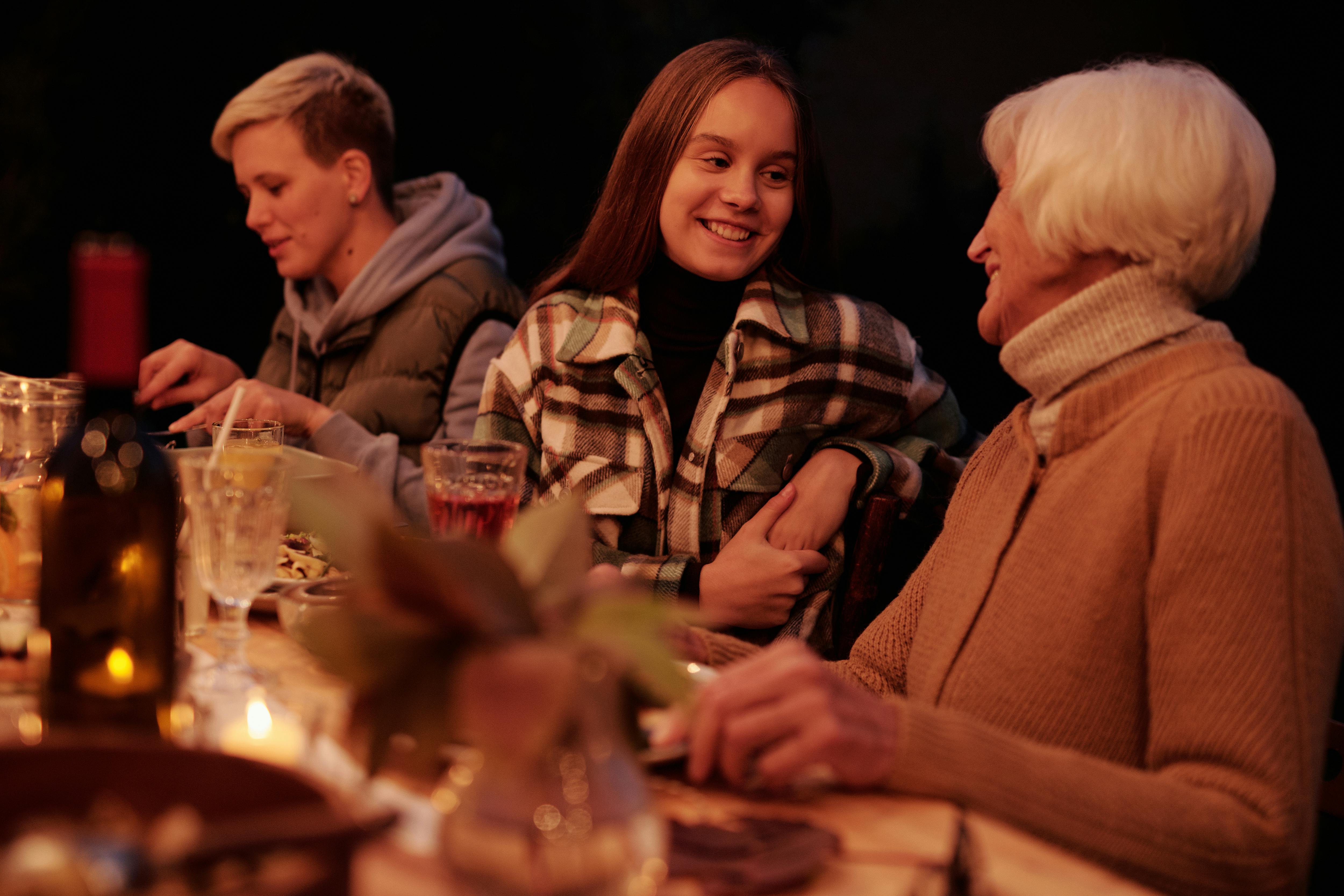 loving family chatting during dinner in garden