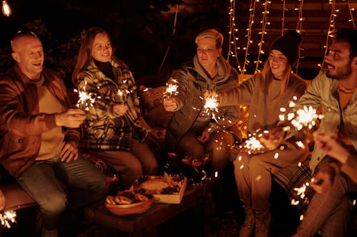 A Group of People Holding Sparklers