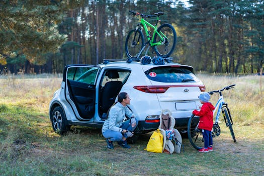 Mother and child preparing for a cycling adventure in a scenic park with bikes and a parked car.