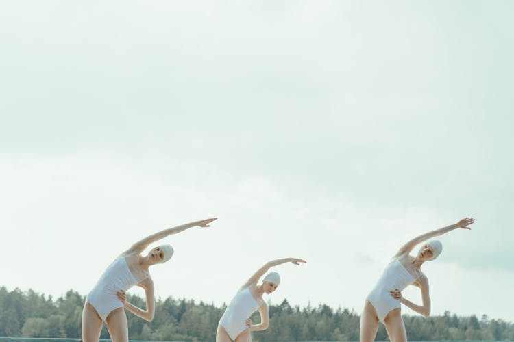 Women In Swimsuits Stretching