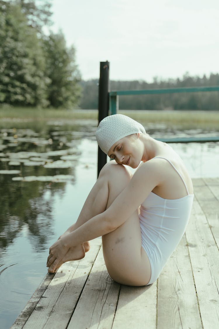 A Woman Wearing Swimsuit And Swimming Cap