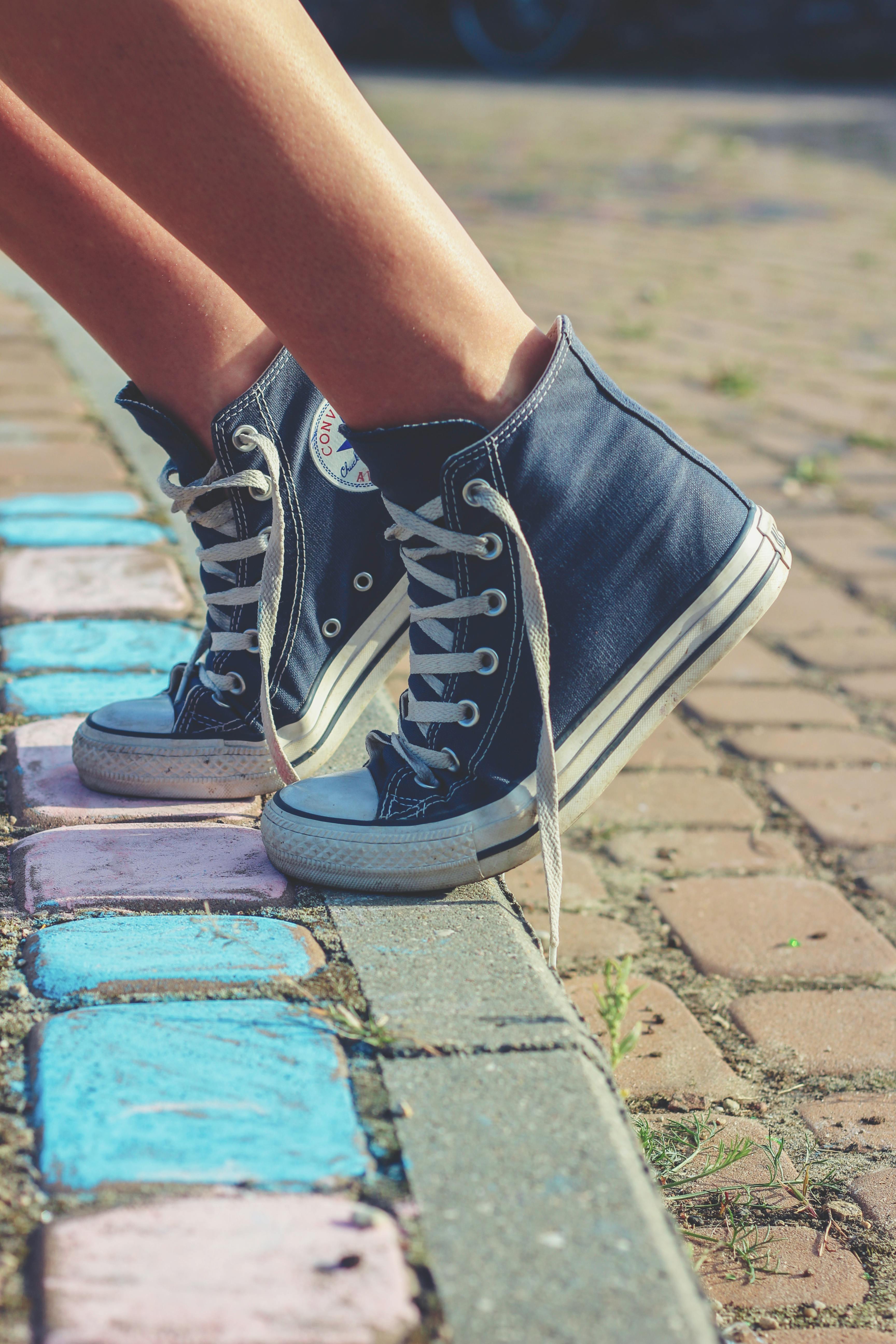 Person Walking Wearing Black Shoes in Grayscale Photography · Free