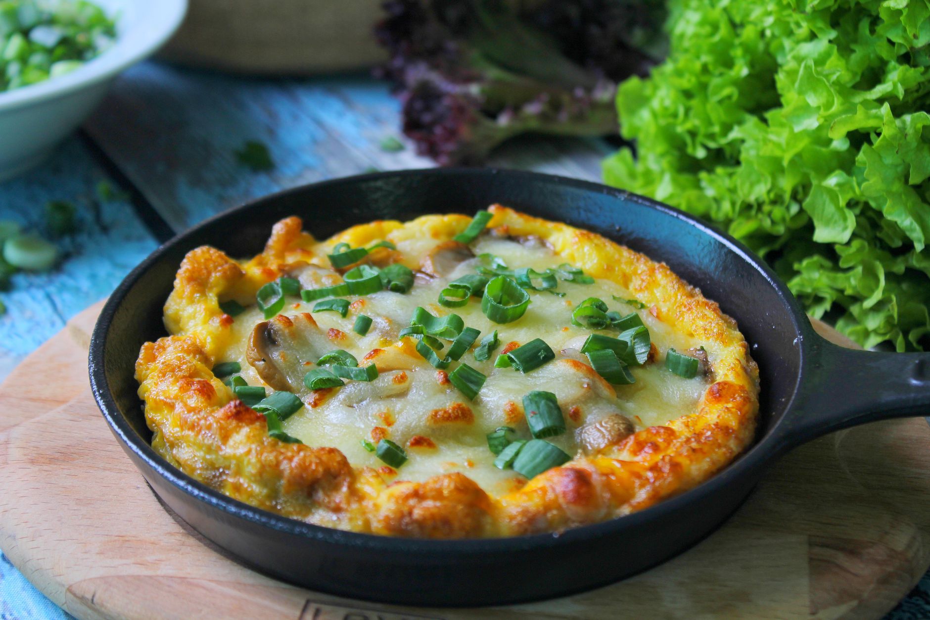 Close-up of cast iron skillet with sizzling vegetables