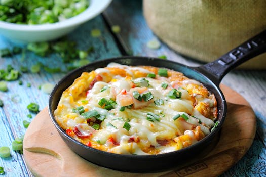 Delicious baked cheese and vegetable dish in a cast iron skillet with fresh herbs.