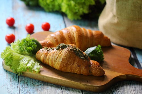 Free Freshly Baked Croissants on Wooden Chopping Board Stock Photo