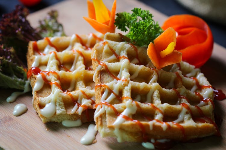 Waffles With Syrup On Wooden Board