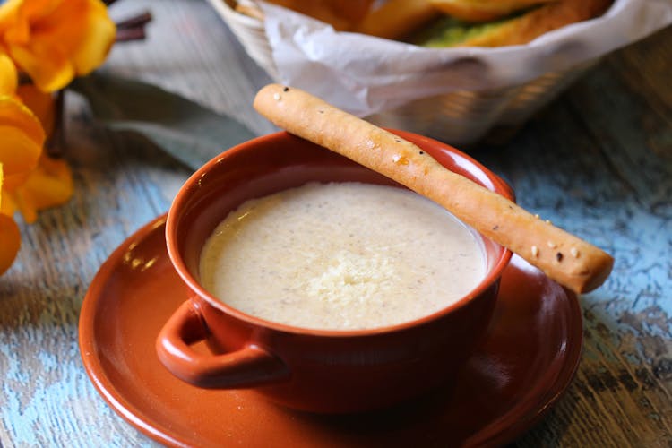 A Bowl Of Soup And A Breadstick