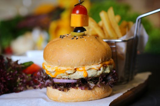 Tasty gourmet cheeseburger with a side of crispy french fries. Perfect for foodies.