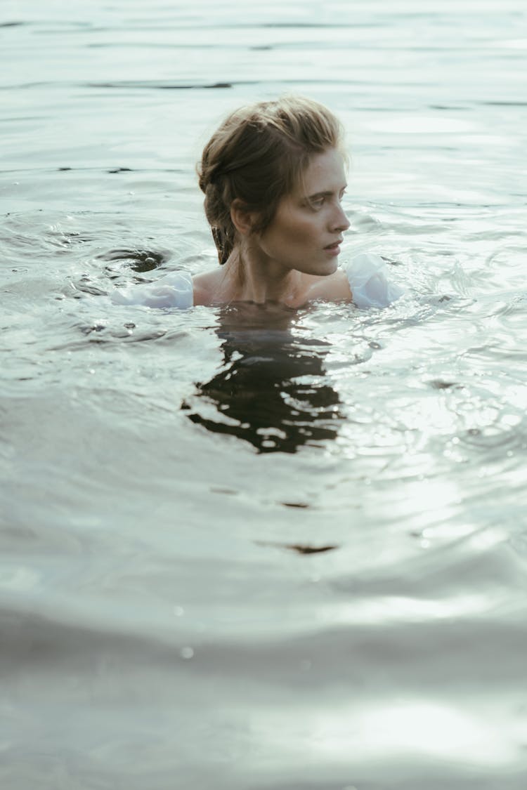 Woman Swimming In A Beach