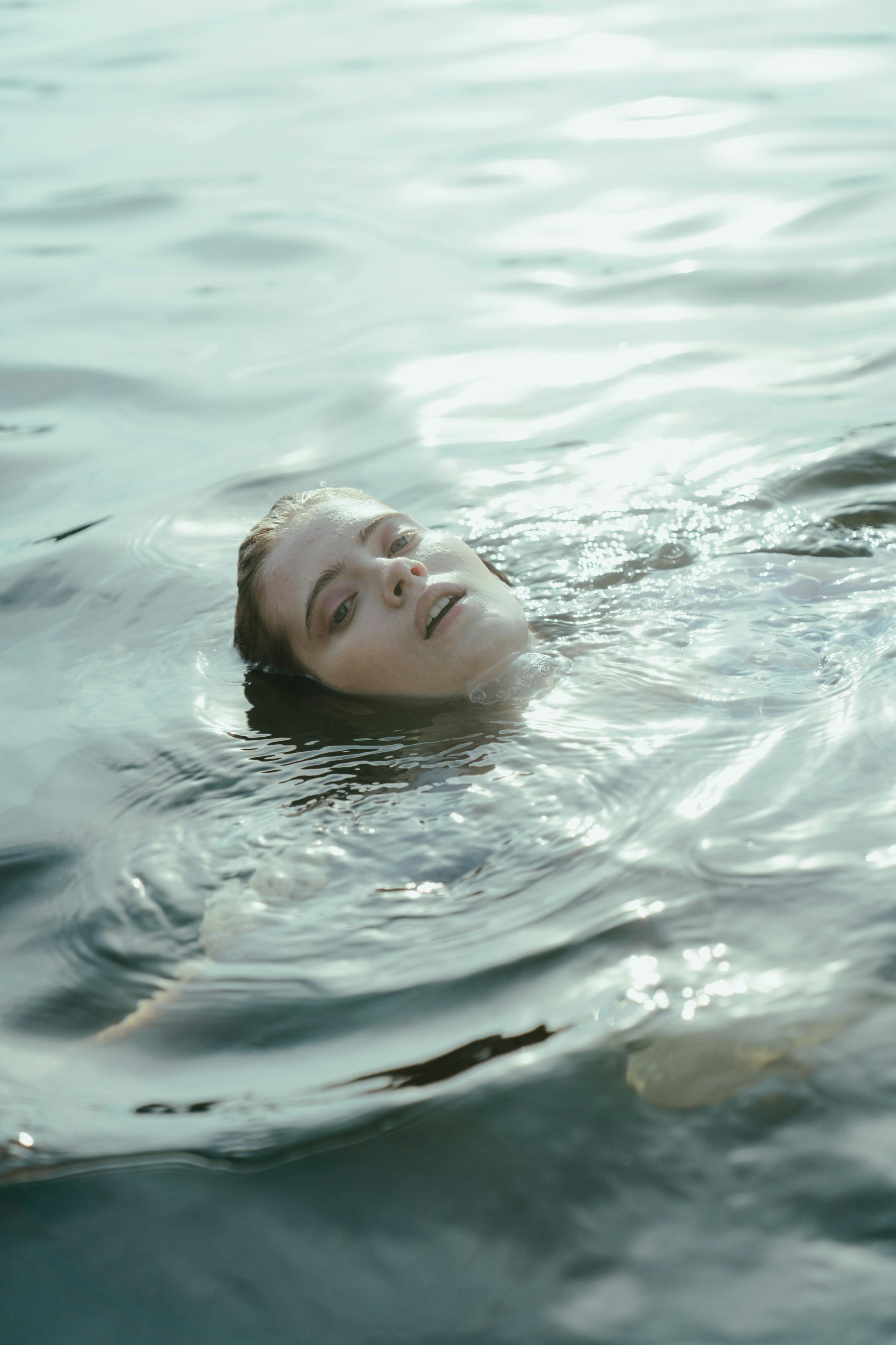 A Woman Skinny Dipping in the Ocean · Free Stock Photo