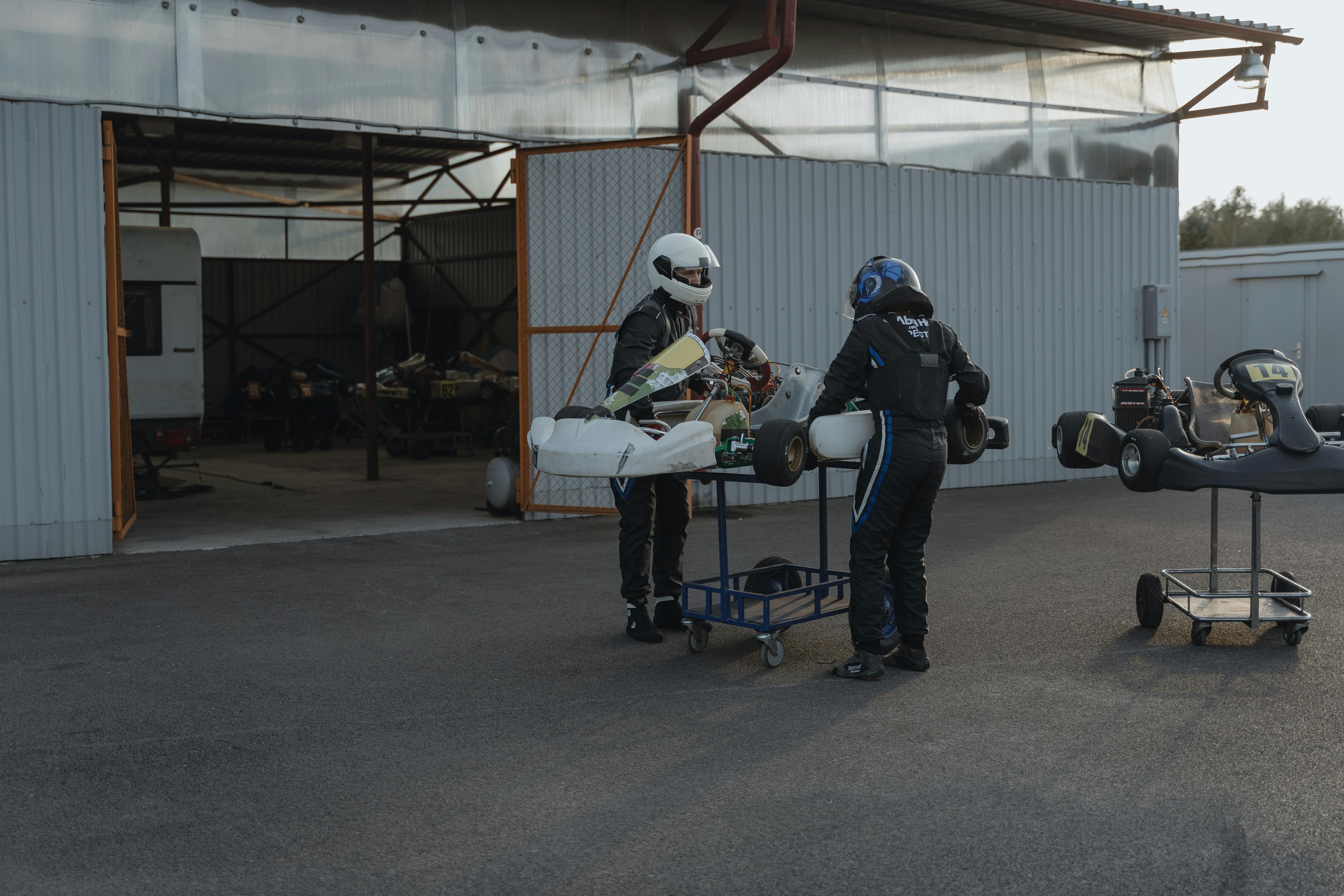 racing drivers standing by gokarts