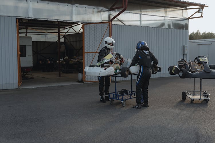 Racing Drivers Standing By Gokarts