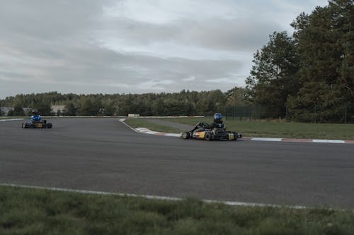 Free Person Driving A Go Kart In The Circuit Stock Photo