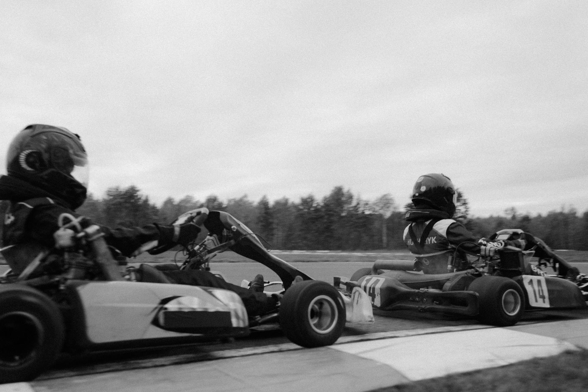 Monochrome Shot of Go Kart Riders Racing