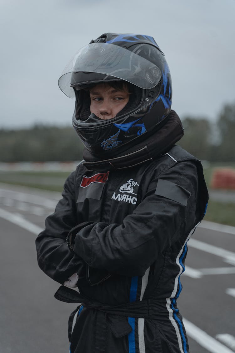 An Athlete In Racing Suit And Helmet