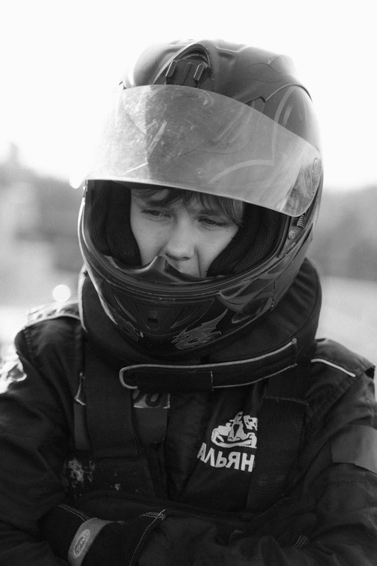 Grayscale Photo Of Man Wearing Helmet