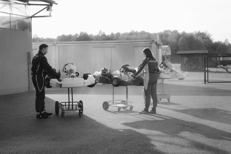 Drivers Standing Near Racing Cars Outdoors