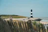 Solitude lighthouse on coastline at sea