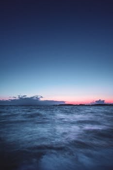 Captivating view of the ocean at sunset in Heringsdorf, Germany, showcasing serene beauty and vibrant colors.