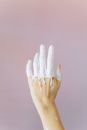 Close-Up Shot of Hand of a Person Soaked in White Paint
