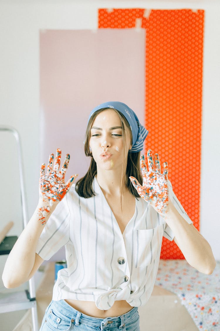 A Woman With Paint On Her Hands