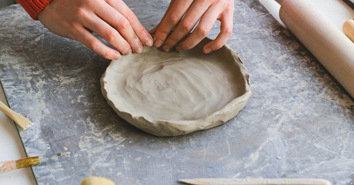 Anonymous Clay Anonymous female shaping piece of clay in workshop · Free Stock Photo