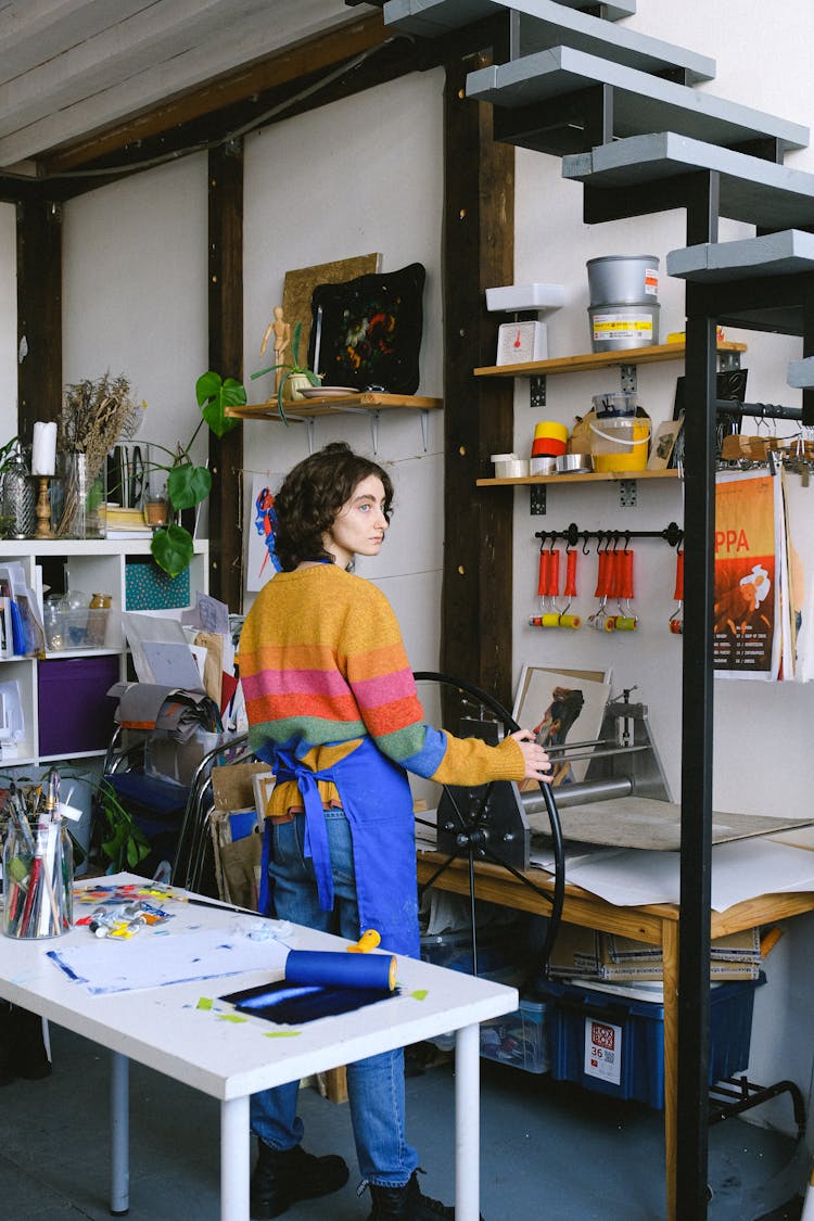 Artist Working In Modern Workshop With Printing Machine