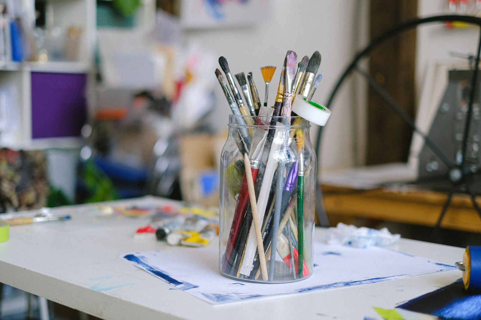Paintbrushes gathered in a glass jar