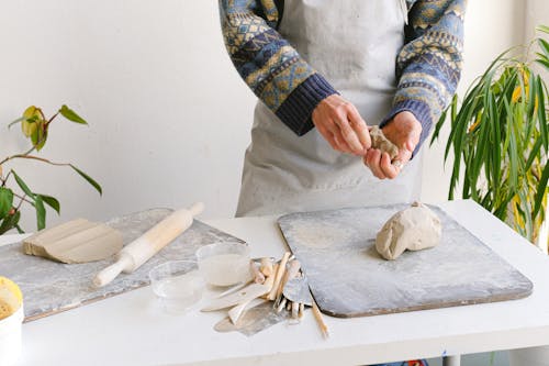 Person Kneading A Dough 