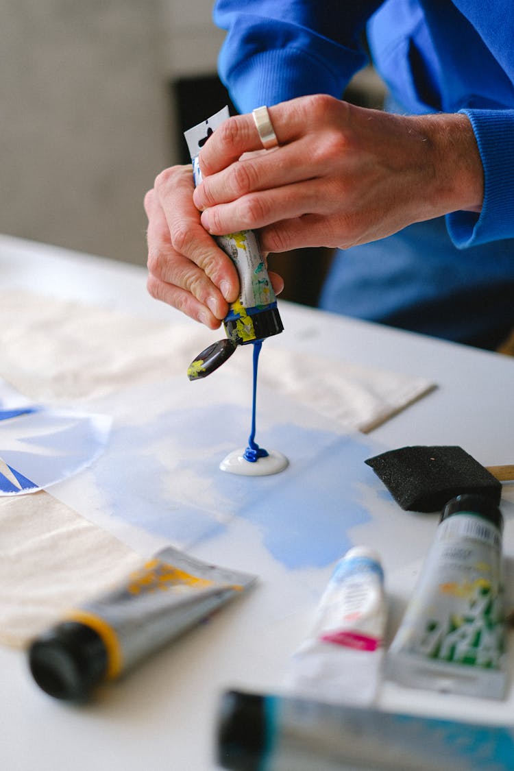 Crop Artist Mixing Paints For Stencil Printing