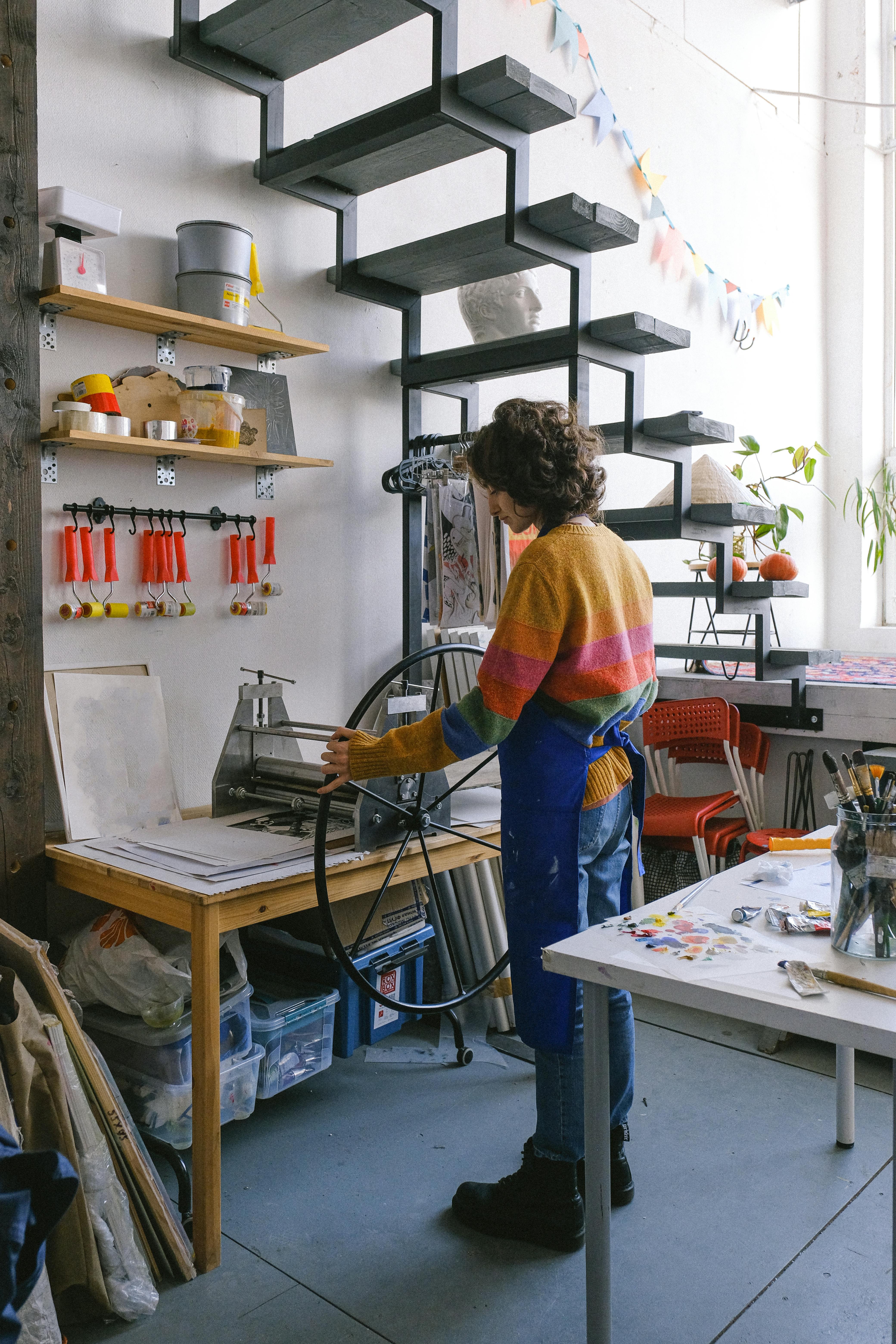 anonymous woman standing near printing press