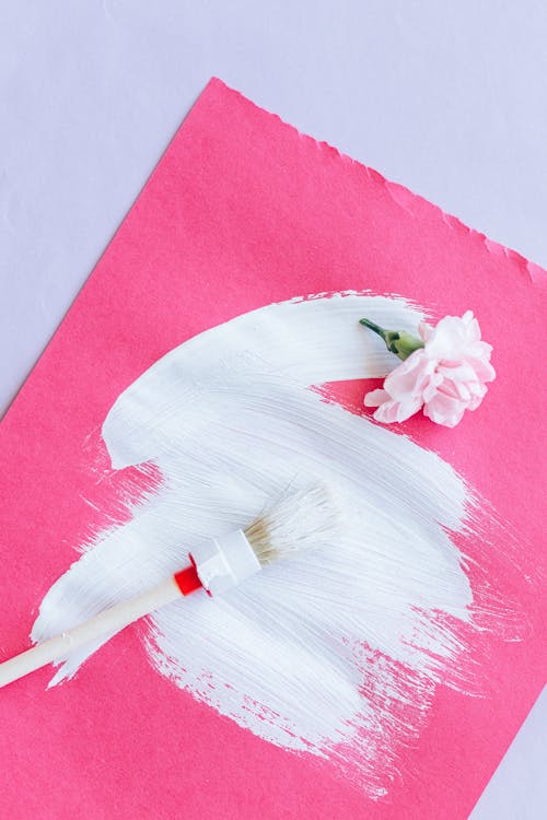 Paintbrush and Flower on a Pink Paper