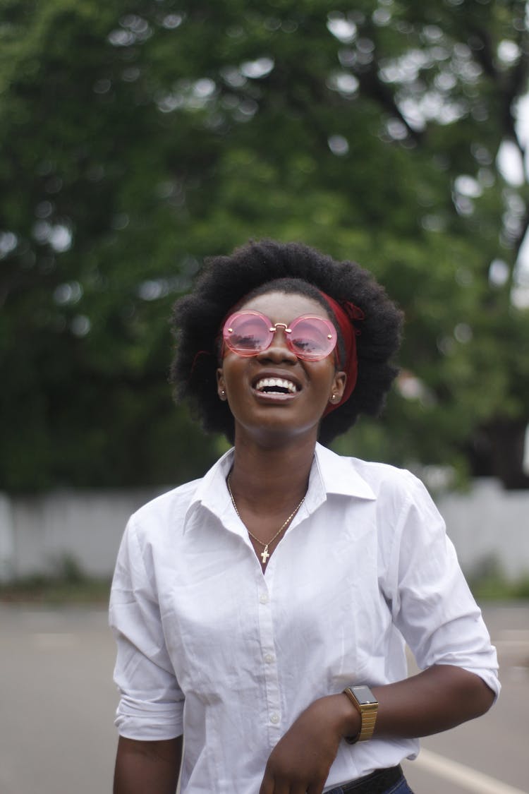 Smiling Woman Wearing Pink Sunglasses