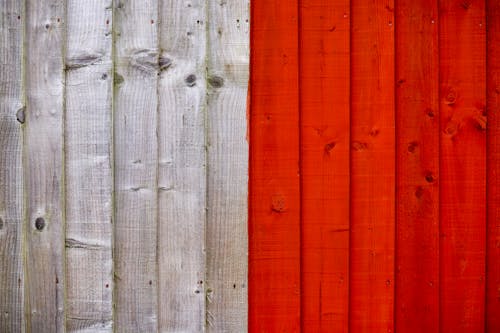 Background of old wooden planks painted with white and bright red colors