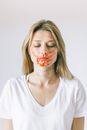 Woman in White Scoop Neck Shirt With Red Lipstick
