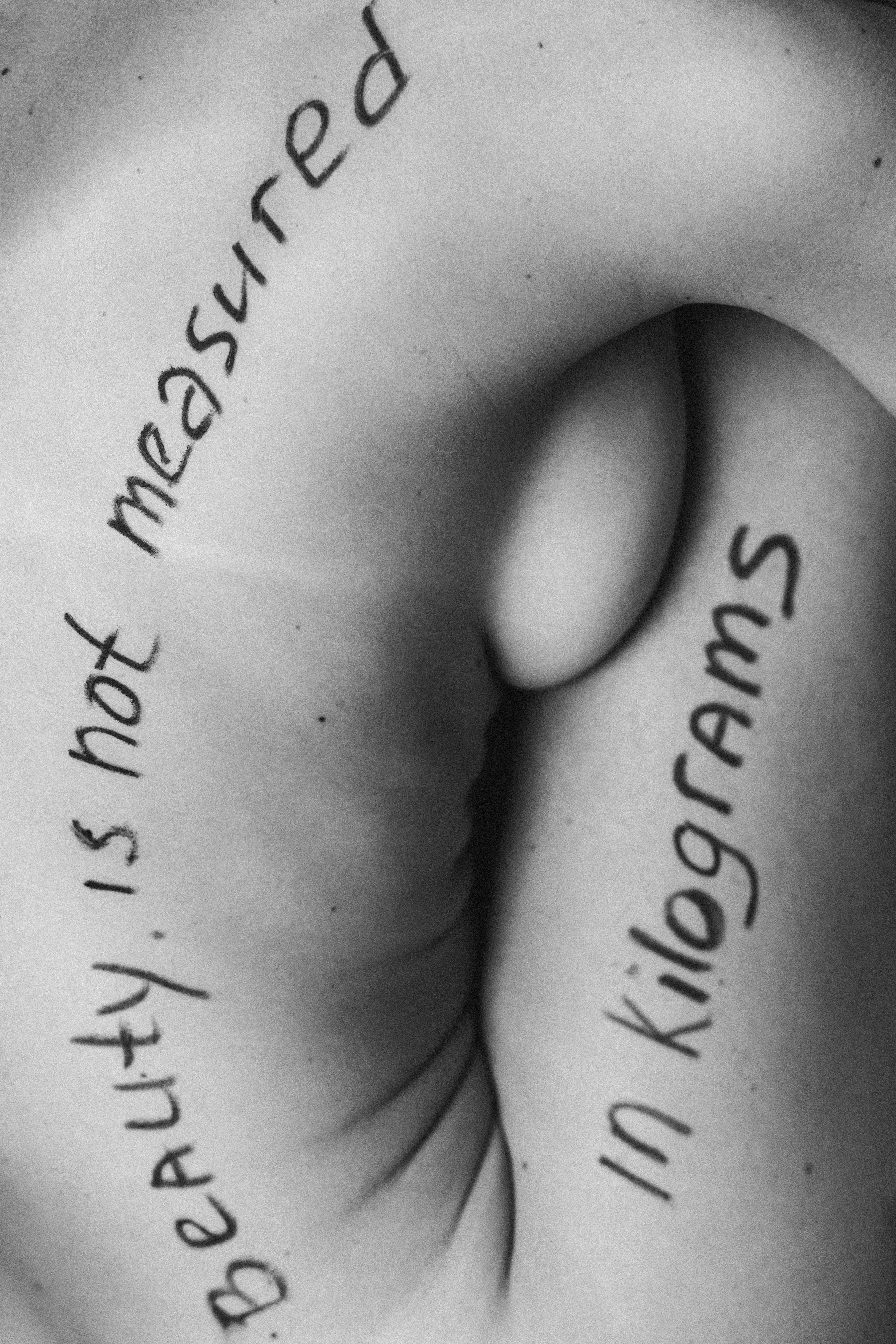 close up photo of a text on a naked body