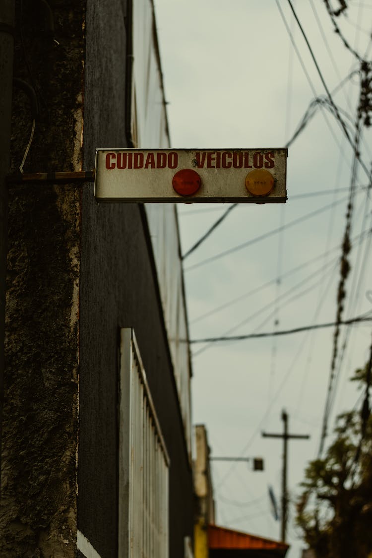 Dirty Sign Hanging From Wall